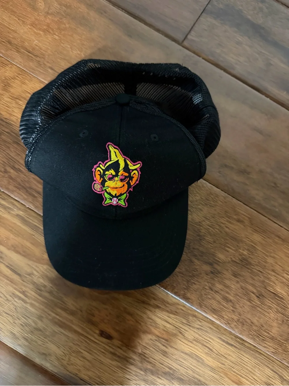 Black Mesh Hat with Neon Embroidered Character